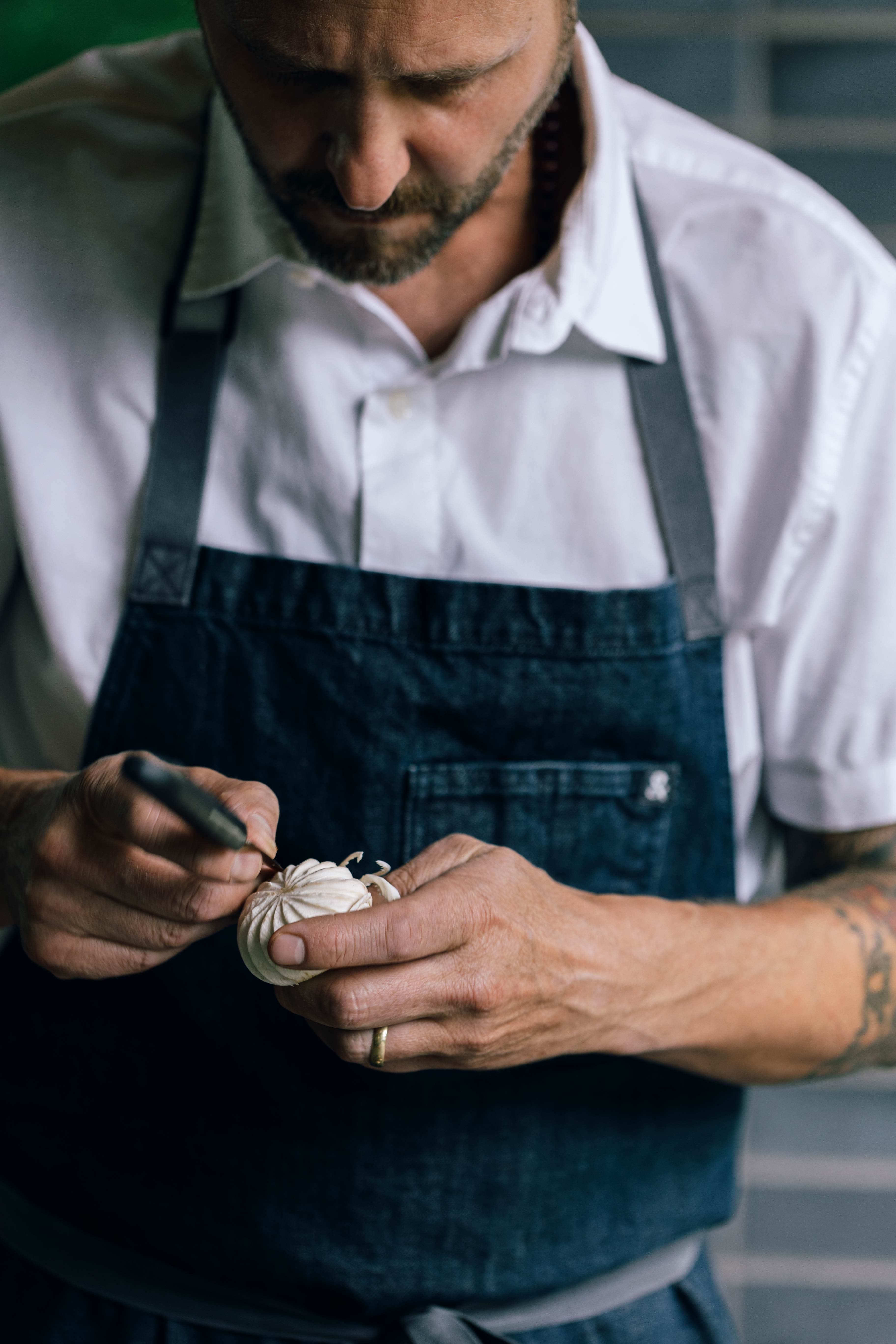 A chef shows off his knife skills with a precise cut.