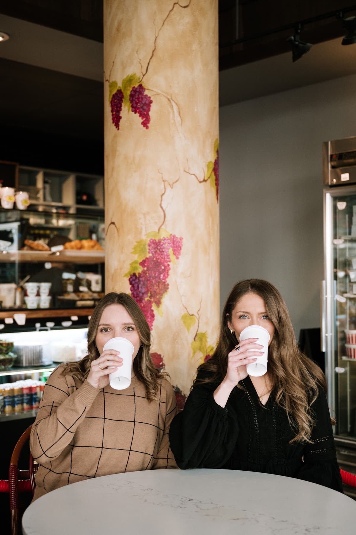 two gals sipping coffee