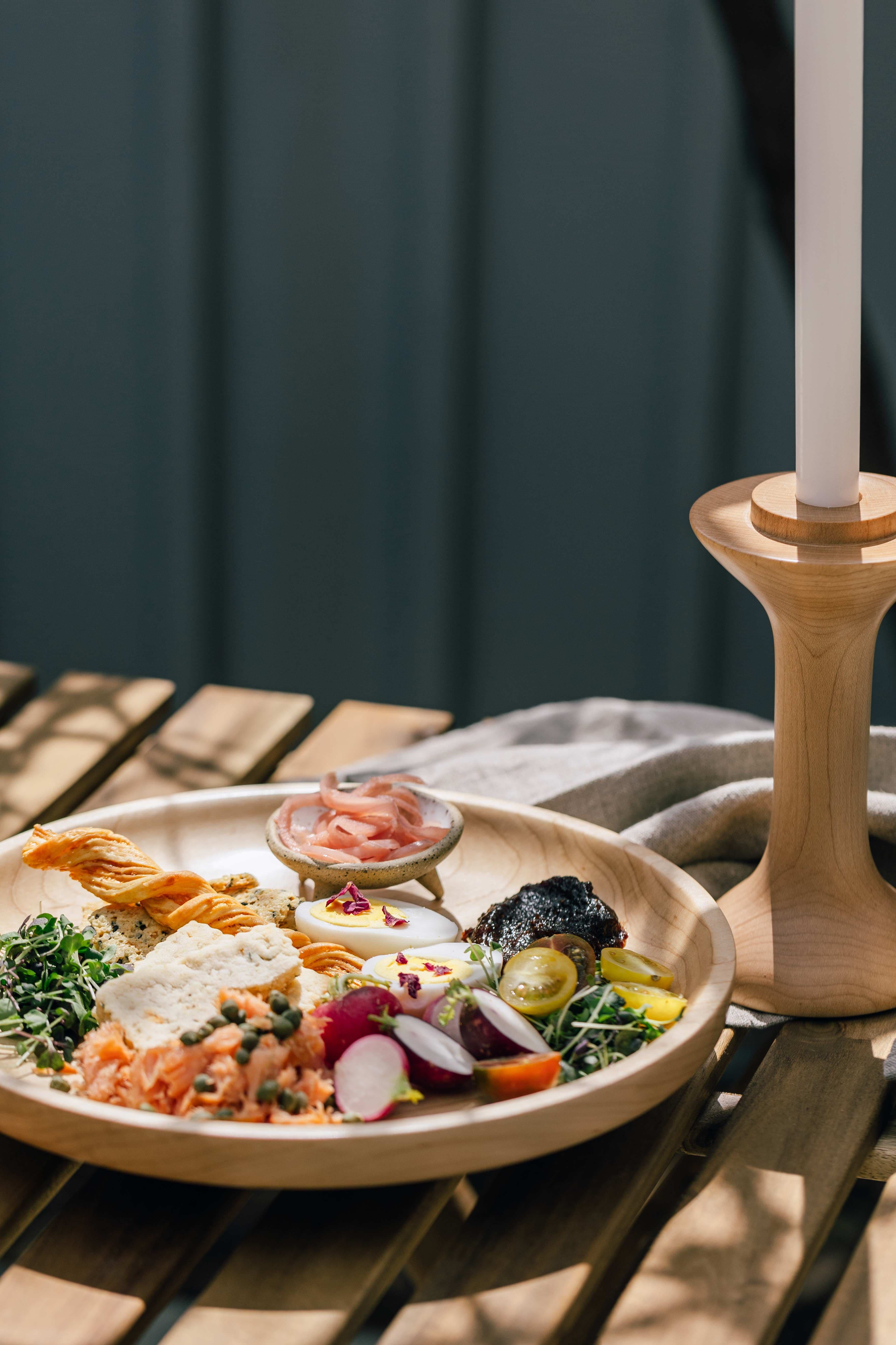 A charcuterie plate on a sunny day.