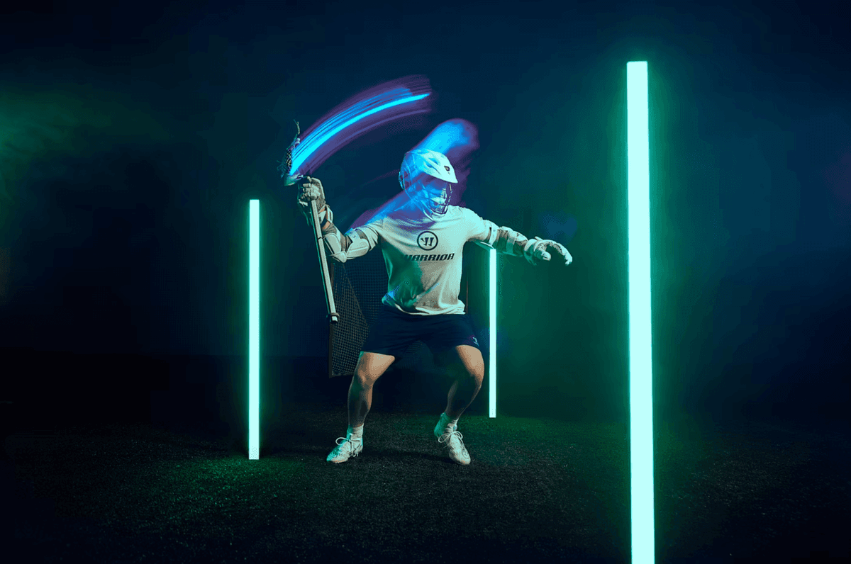 Athlete shoot for Warrior Lacrosse, using slow shutter and colored lights to create motion