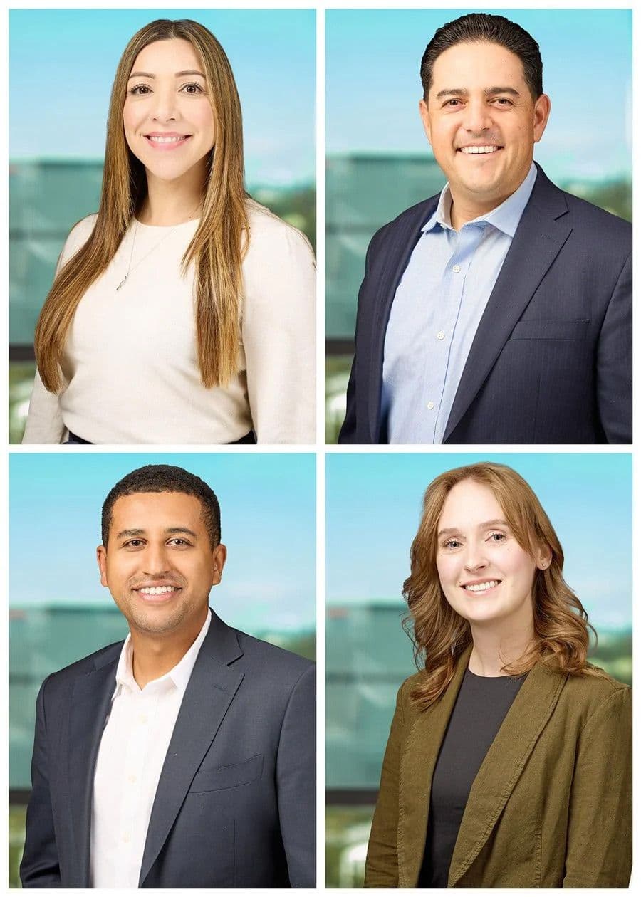 Professional team headshots in Denver of four individuals photographed in natural light with a modern office background.